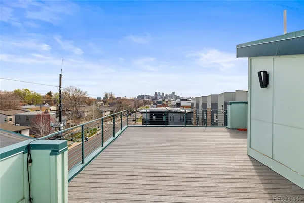 a view of a balcony with wooden floor