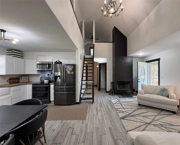 a kitchen with refrigerator and cabinets