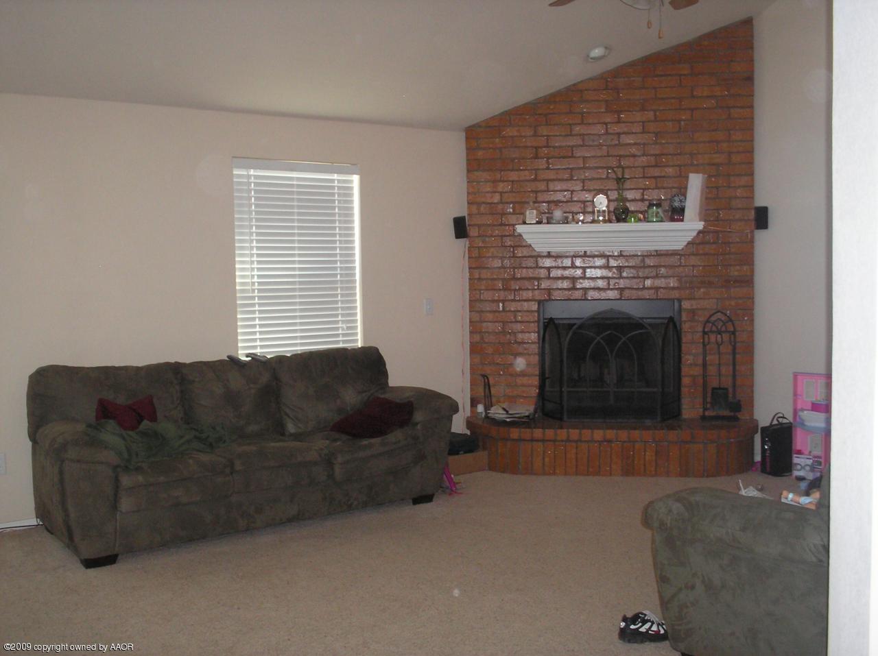 4804 Nimbus Lane Amarillo, TX 79110 - Photo 7 of 21 a living room with furniture and a fireplace
