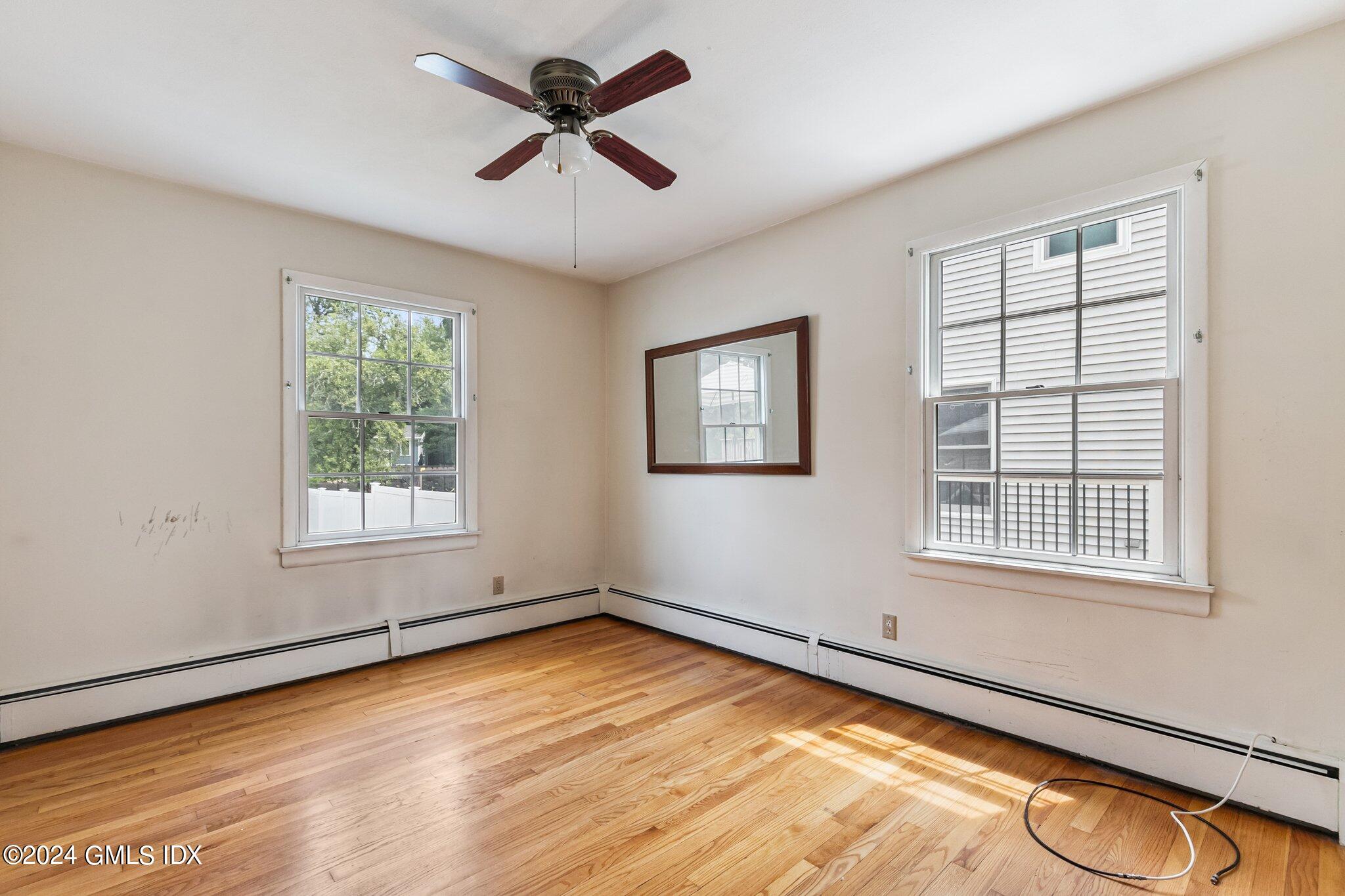 15 Thorn Hill Road Riverside, CT 06878 - Photo 11 of 30 a view of empty room with wooden floor and fan