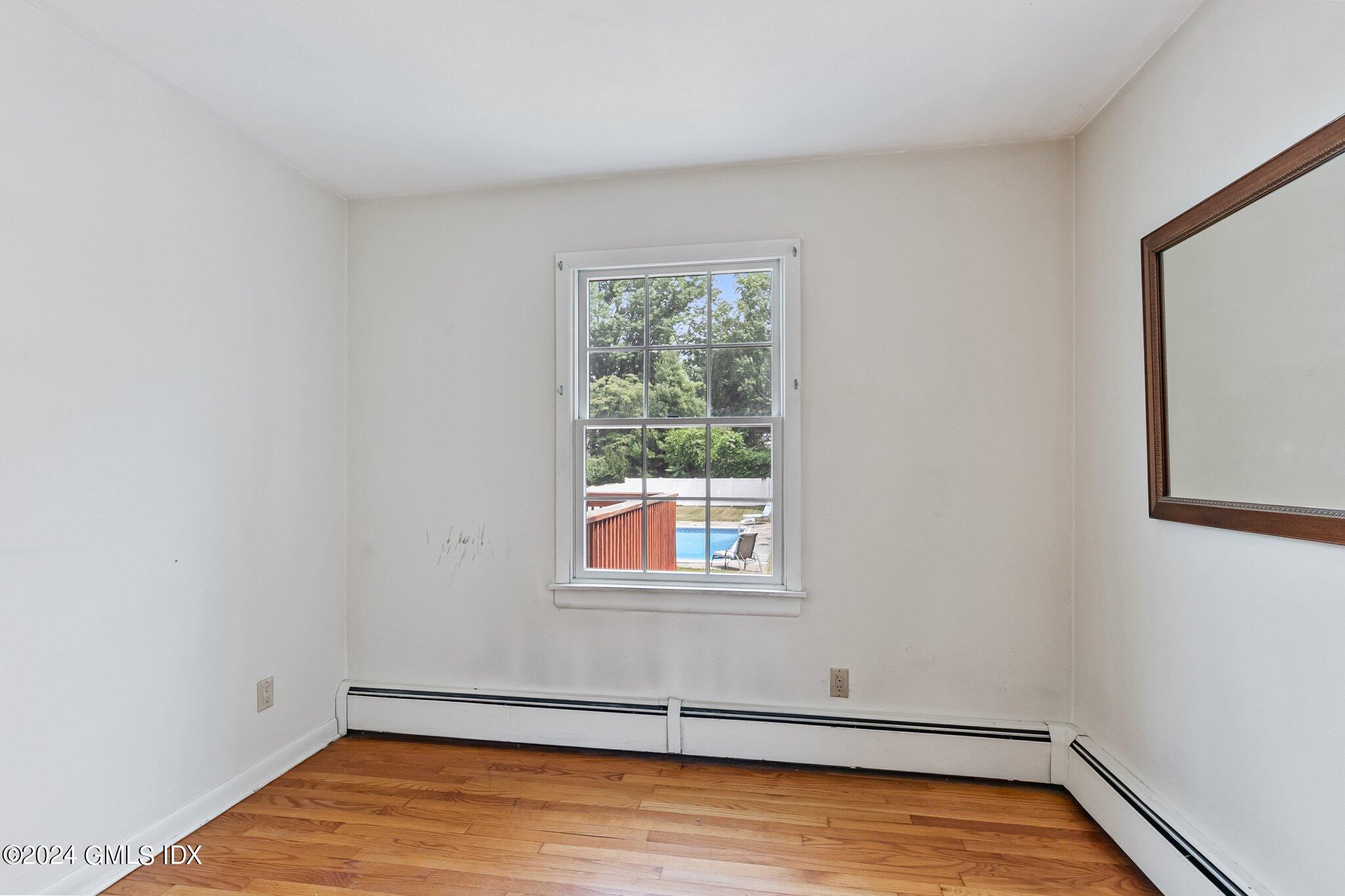 15 Thorn Hill Road Riverside, CT 06878 - Photo 12 of 30 a view of a room with wooden floor and a window