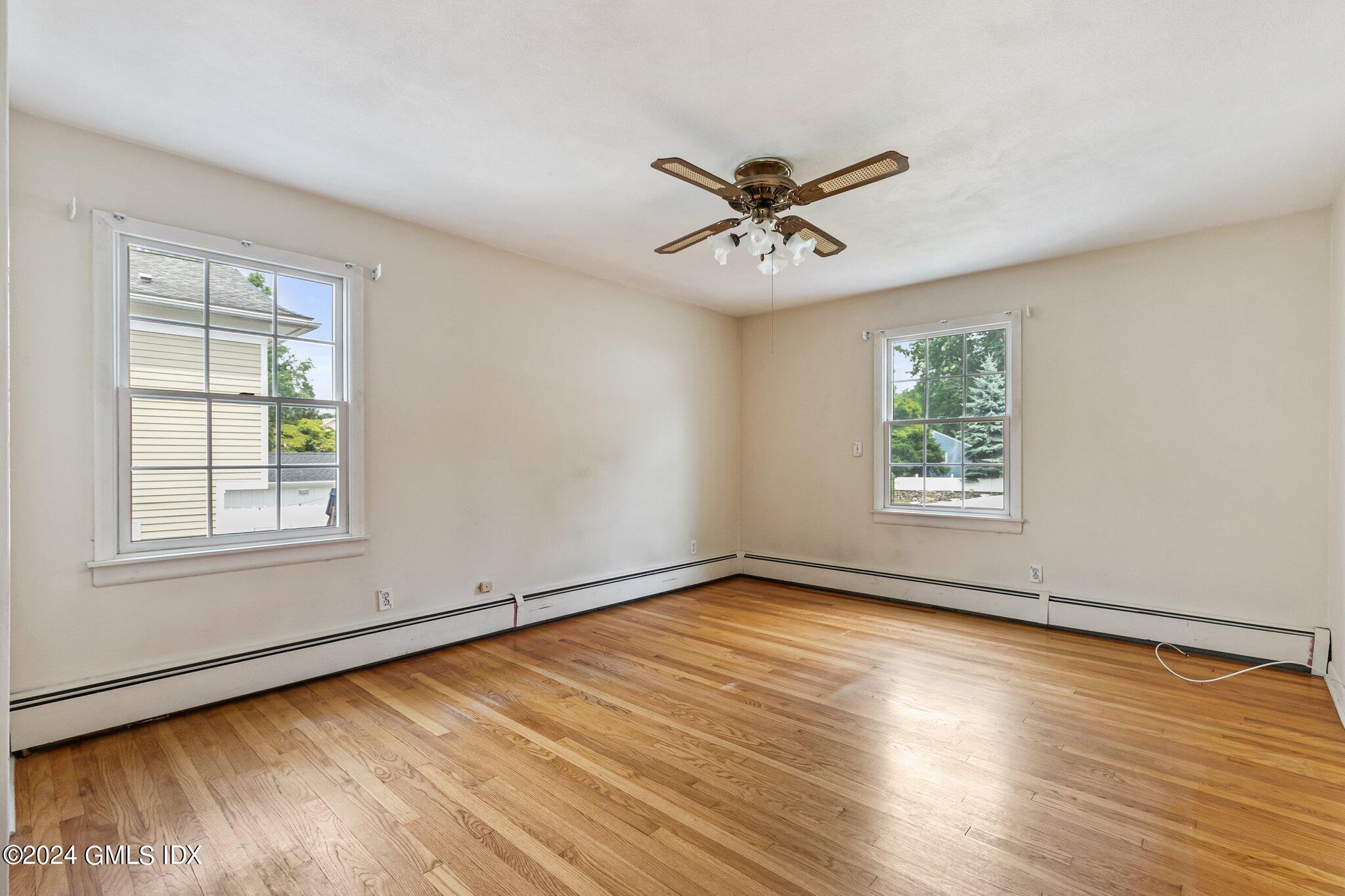 15 Thorn Hill Road Riverside, CT 06878 - Photo 14 of 30 a view of an empty room with wooden floor and a window