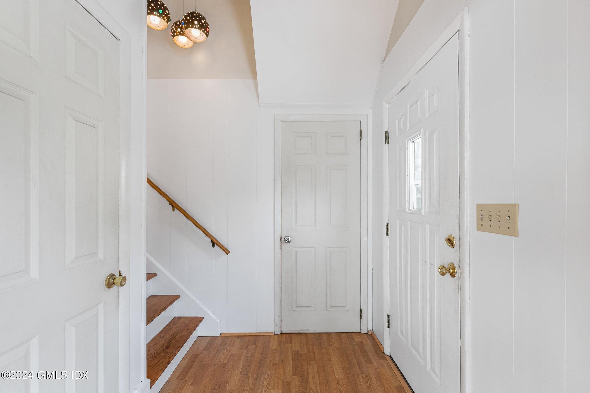15 Thorn Hill Road Riverside, CT 06878 - Photo 2 of 30 a view of a hallway with wooden floor and staircase