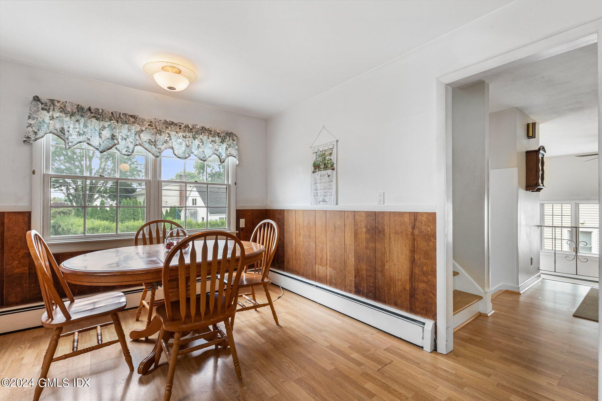 15 Thorn Hill Road Riverside, CT 06878 - Photo 9 of 30 a view of a dining room with furniture window and wooden floor