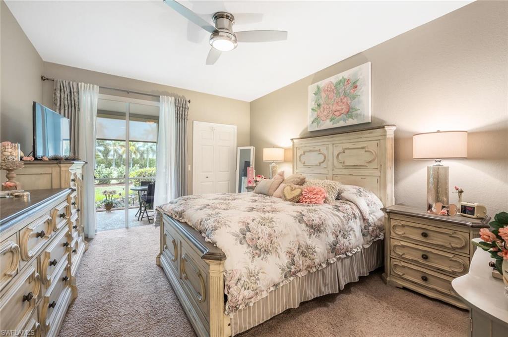 7005 Pinnacle Lane, Unit 1501 Naples, FL 34110 - Photo 19 of 45 a bedroom with a bed and a dresser