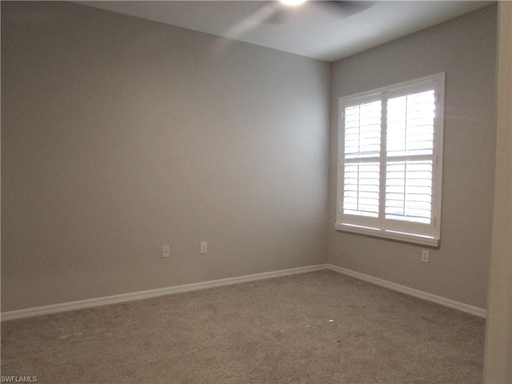 7005 Pinnacle Lane, Unit 1501 Naples, FL 34110 - Photo 26 of 45 an empty room with a window