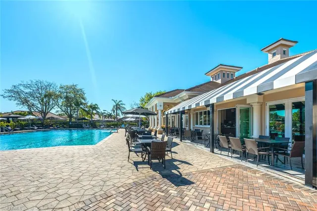 a view of a patio with chairs and table on the patio