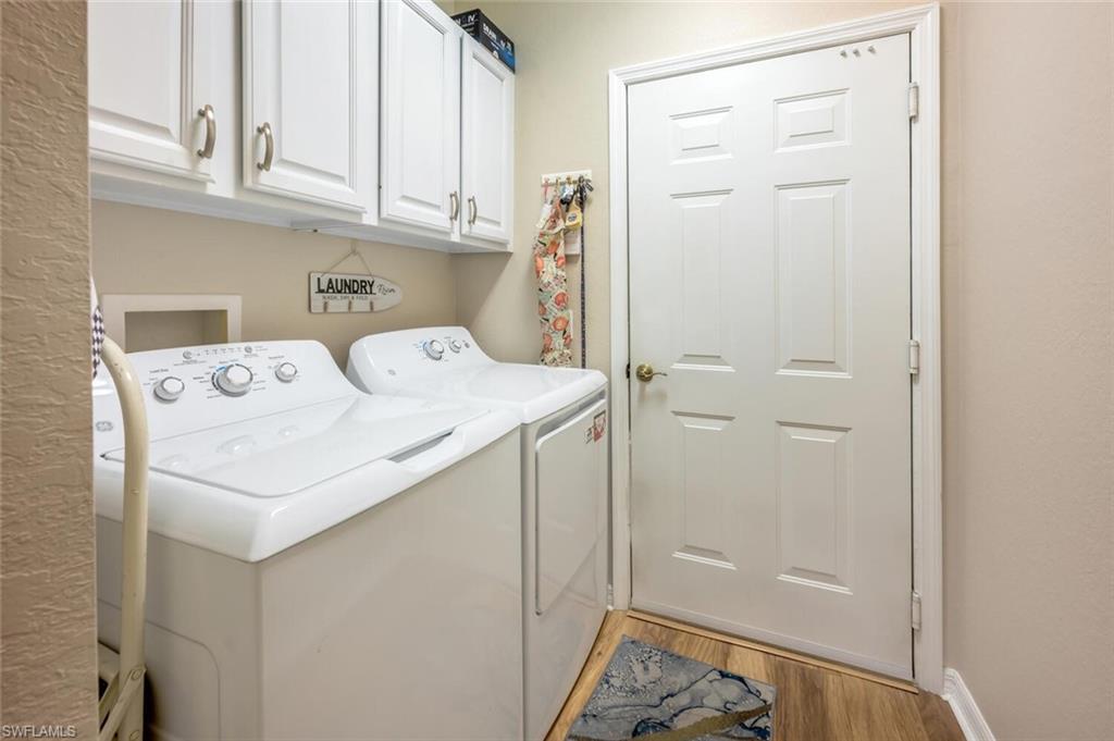 7005 Pinnacle Lane, Unit 1501 Naples, FL 34110 - Photo 29 of 45 a utility room with dryer and washer