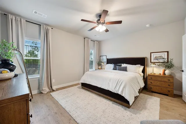 a bedroom with a large bed and a window