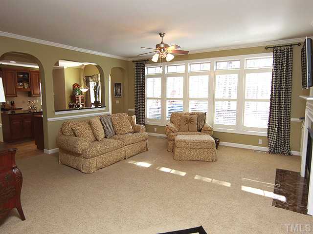 8232 Clarks Branch Drive Raleigh, NC 27613 - Photo 4 of 11 a living room with furniture and a large window