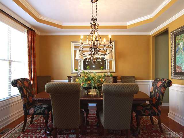 8232 Clarks Branch Drive Raleigh, NC 27613 - Photo 6 of 11 a view of a dining room with furniture window and outside view
