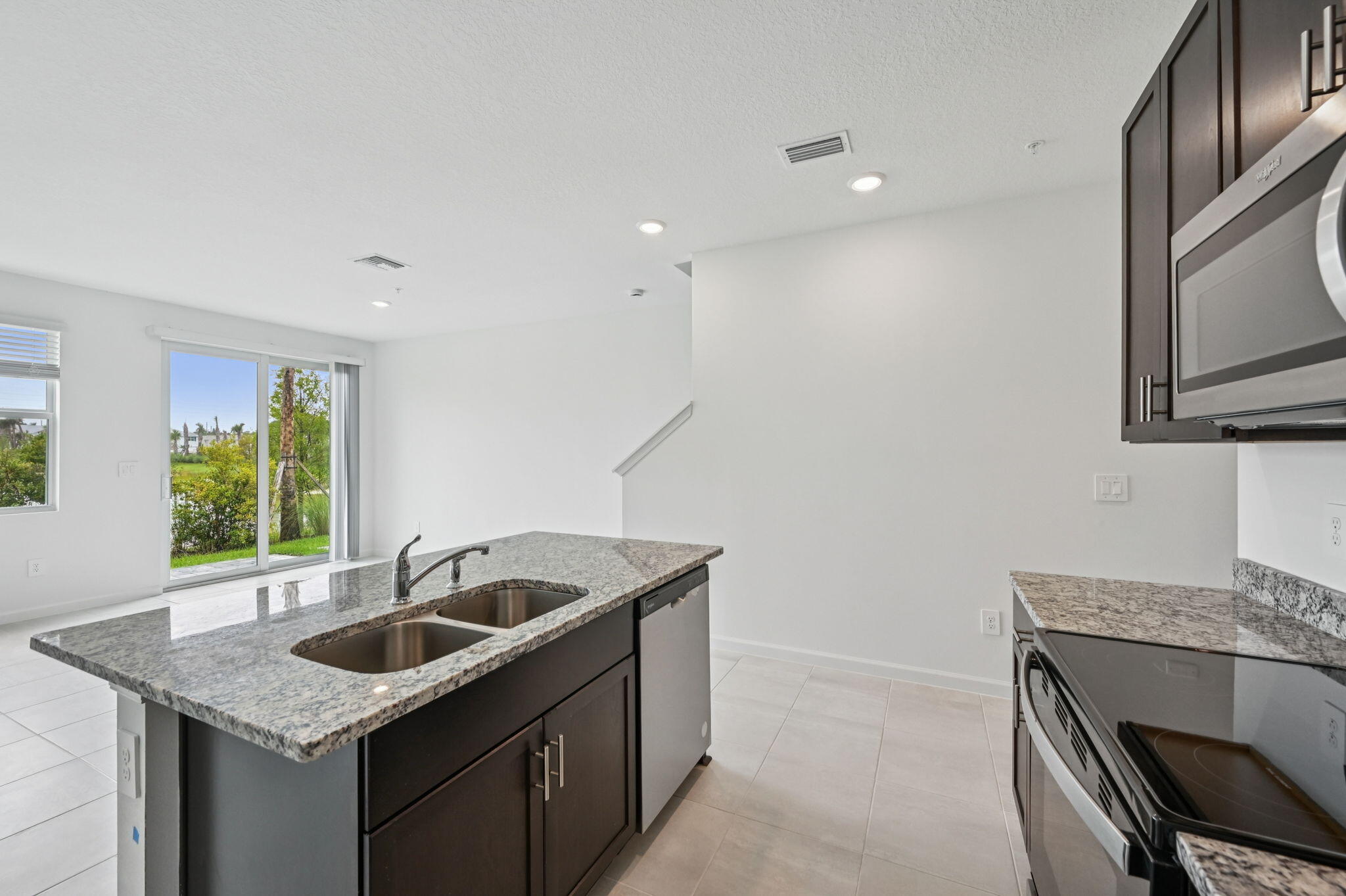 475 Salisbury Circle Fort Pierce, FL 34982 - Photo 12 of 30 a kitchen that has a sink and a stove in it
