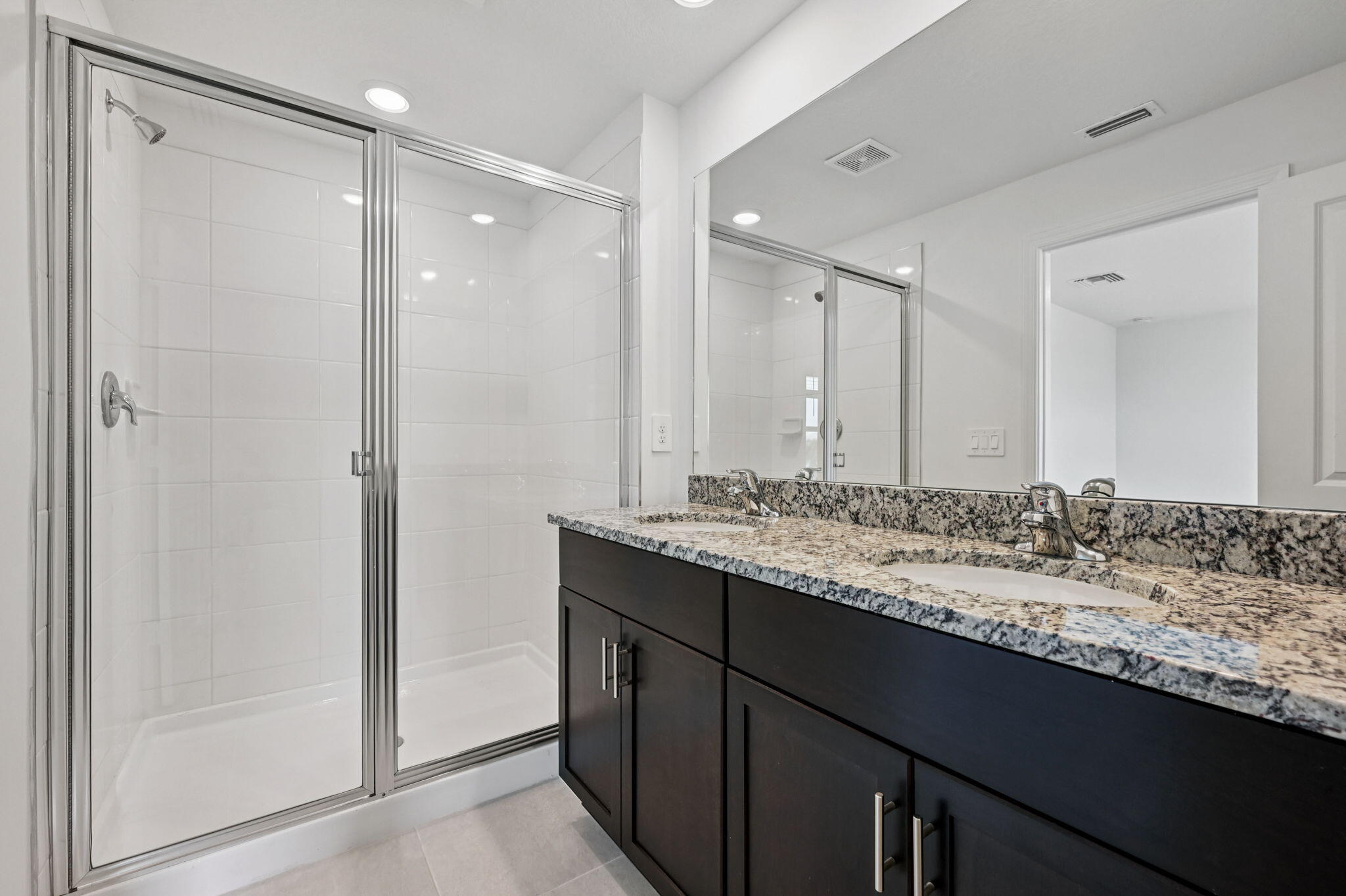 475 Salisbury Circle Fort Pierce, FL 34982 - Photo 25 of 30 a bathroom with a granite countertop sink and a mirror