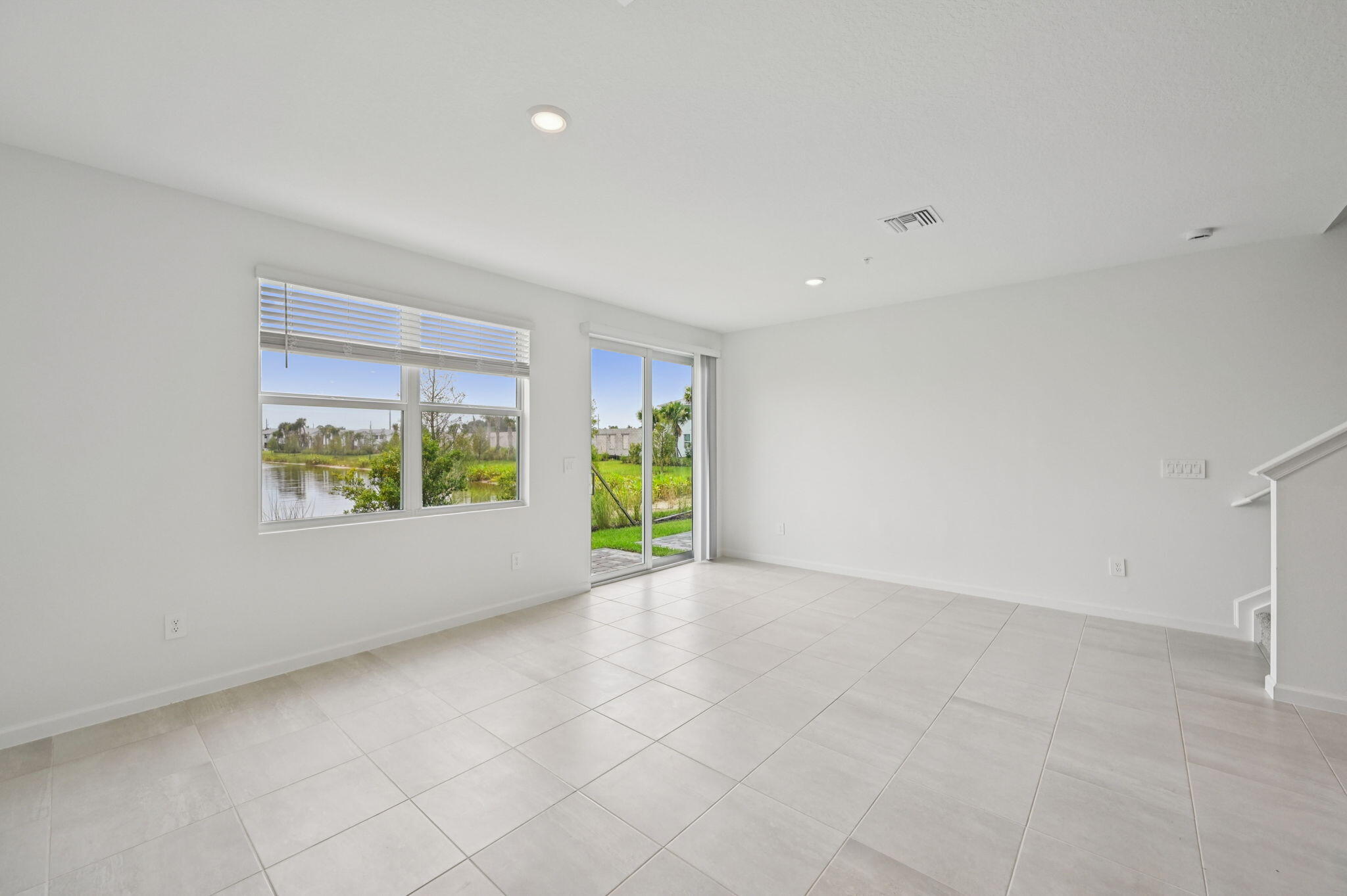 475 Salisbury Circle Fort Pierce, FL 34982 - Photo 5 of 30 wooden floor in an empty room with a window