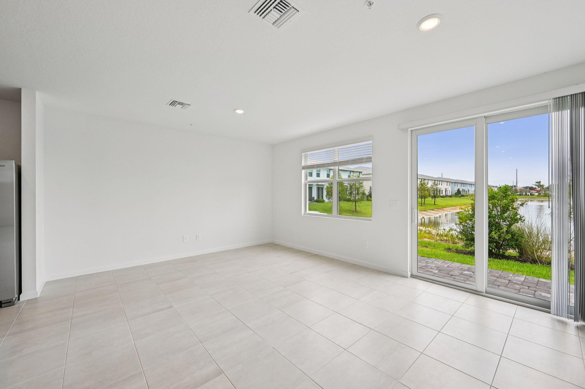 475 Salisbury Circle Fort Pierce, FL 34982 - Photo 6 of 30 a view of an empty room with a window
