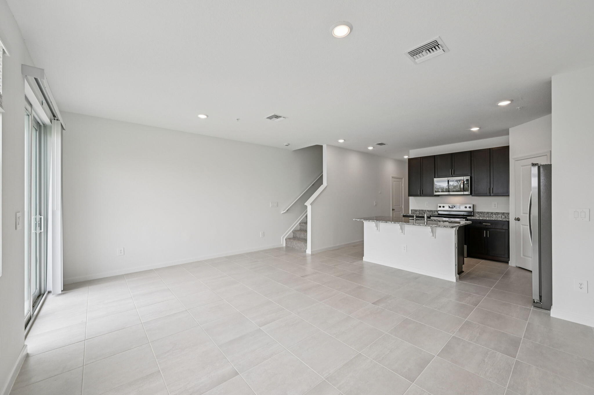 475 Salisbury Circle Fort Pierce, FL 34982 - Photo 8 of 30 a kitchen with stainless steel appliances a refrigerator sink and stove