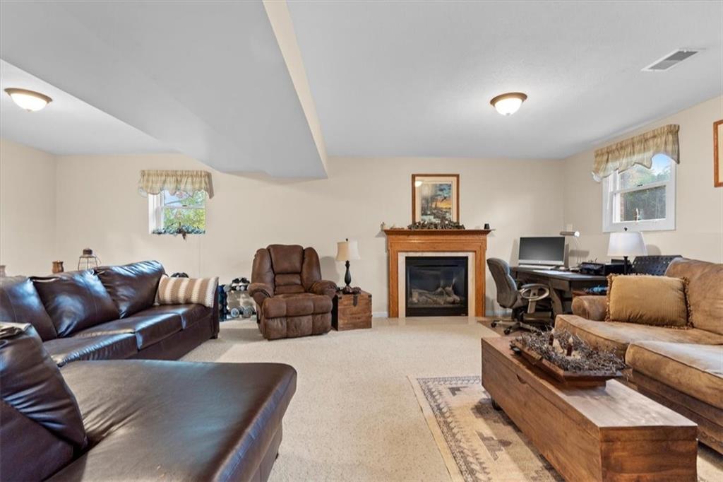 131 Double Road Renfrew, PA 16053 - Photo 16 of 25 a living room with furniture and a fireplace