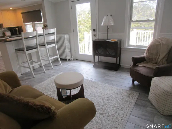 a living room with furniture and a window