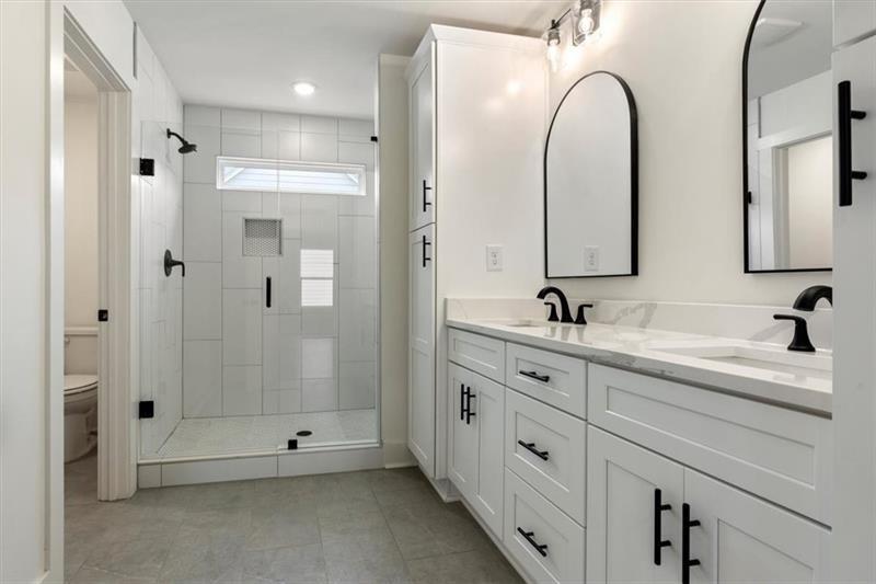 131 Old Alabama Road Southeast Emerson, GA 30137 - Photo 24 of 44 a spacious bathroom with a double vanity sink mirror and shower