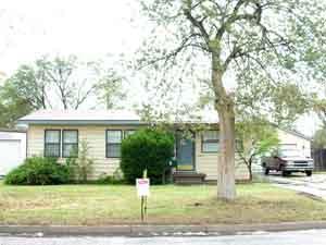 4420 South Ong Street Amarillo, TX 79110 - Photo 1 of 12 a front view of a house with a yard