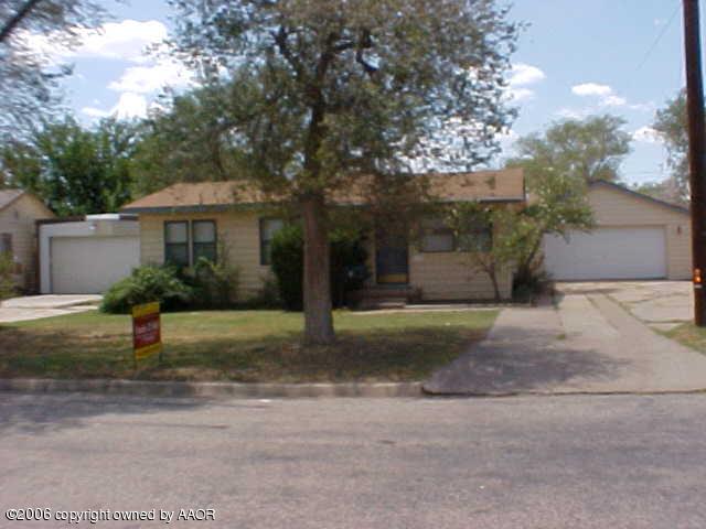 4420 South Ong Street Amarillo, TX 79110 - Photo 2 of 12 a front view of a house with a yard and a garage