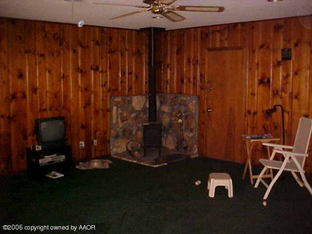4420 South Ong Street Amarillo, TX 79110 - Photo 4 of 12 a room with pool table and a chandelier