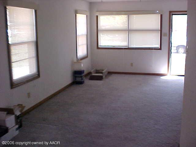 4420 South Ong Street Amarillo, TX 79110 - Photo 6 of 12 an empty room with windows