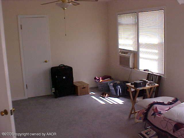 4420 South Ong Street Amarillo, TX 79110 - Photo 9 of 12 a room with furniture and window