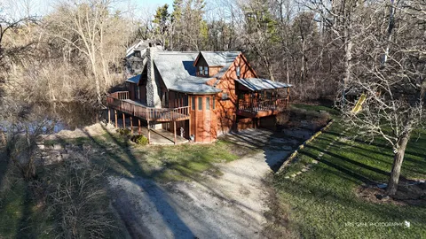 a view of a small house with a yard