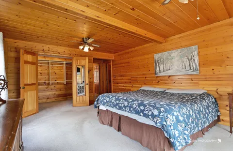 a bedroom with a bed and a table