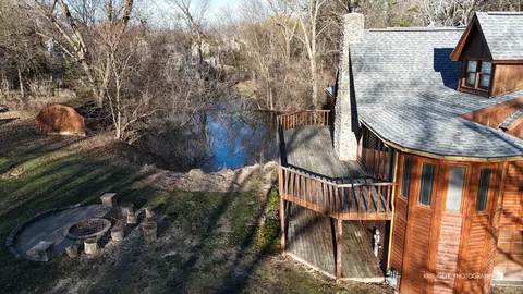 a balcony with table and chairs