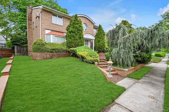a front view of a house with garden