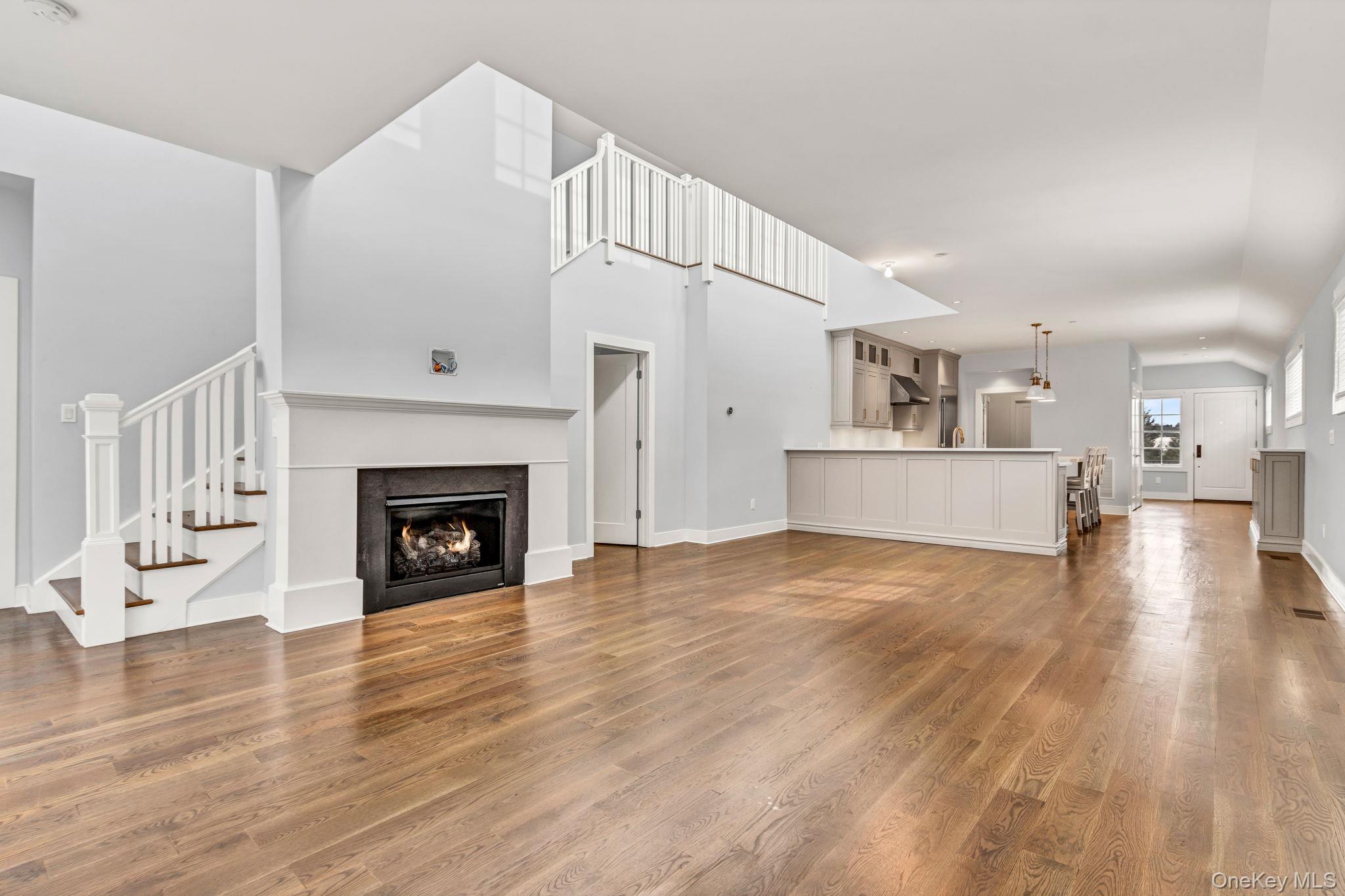 21 Honeysuckle Lane Rye Brook, NY 10573 - Photo 7 of 48 a view of a livingroom with wooden floor and a fireplace