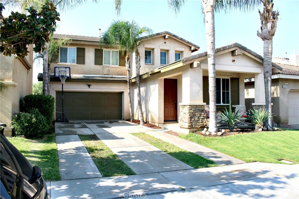 1439 Alta Palma Road Perris, CA 92571 - Photo 1 of 1 a front view of a house with a yard and potted plants