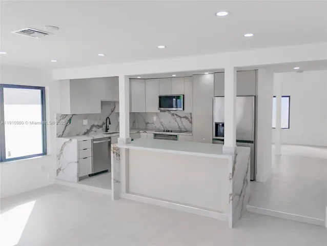 a kitchen with a stove and a microwave