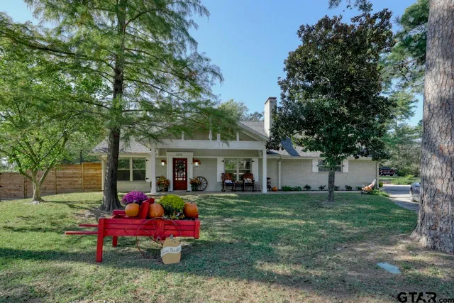 a view of a house with a yard porch and sitting area