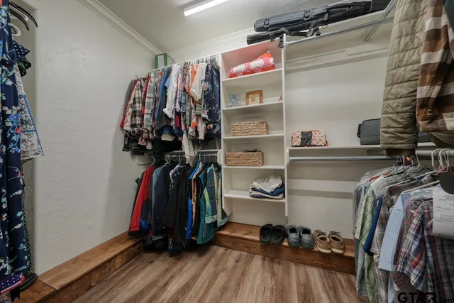 a bathroom with a double vanity sink a mirror and shower