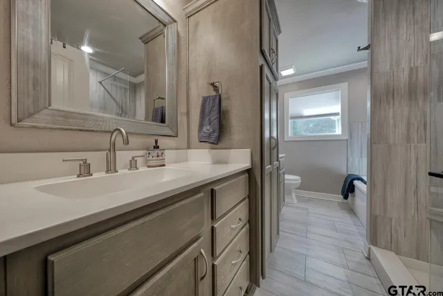 a bathroom with a bathtub and a shower