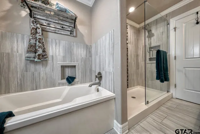 a spacious bedroom with a bed and a couch