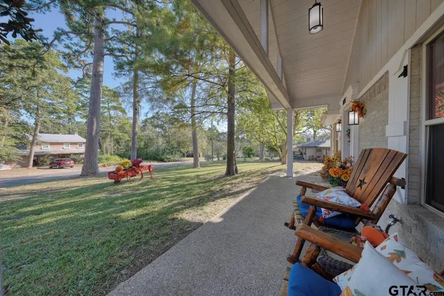 a view of a two chairs in a patio
