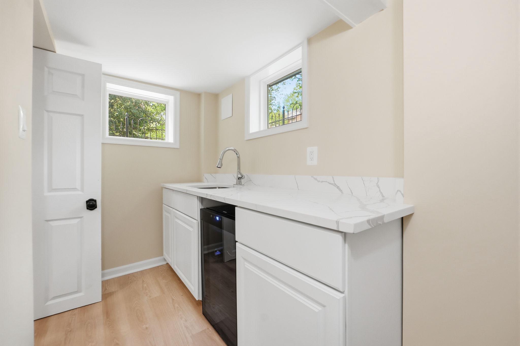 518 Columbia Road Northwest Washington, DC 20001 - Photo 27 of 35 Bright and airy laundry space.