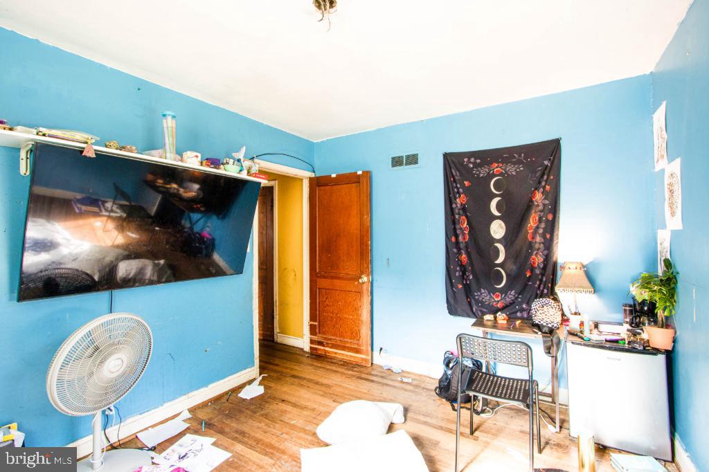 719 Wampler Road Baltimore, MD 21220 - Photo 11 of 18 a living room with furniture and a flat screen tv