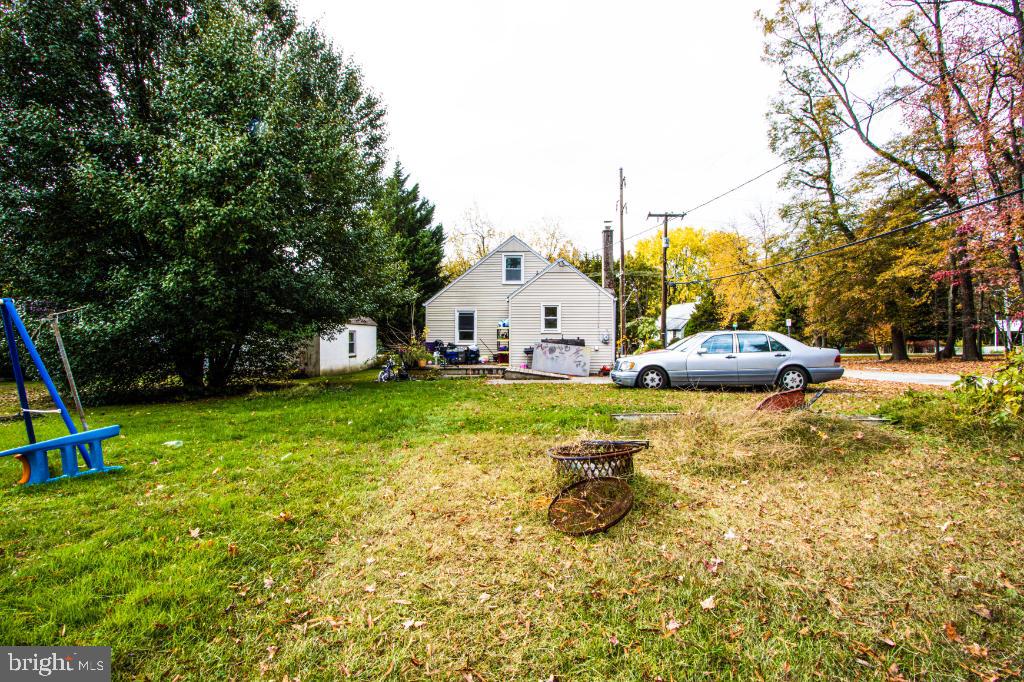 719 Wampler Road Baltimore, MD 21220 - Photo 5 of 18 a view of a house with a yard and sitting area