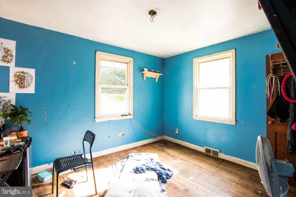 719 Wampler Road Baltimore, MD 21220 - Photo 10 of 18 a view of a room with gym equipment and a window