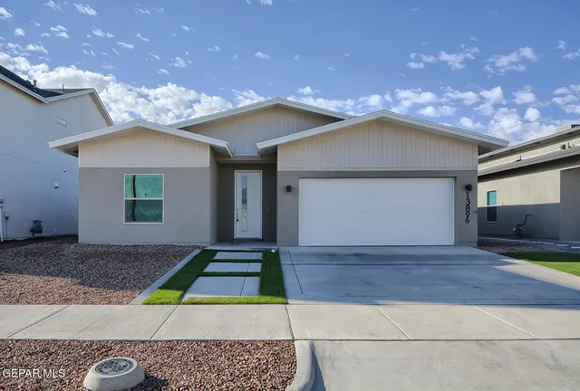 a front view of a house with yard