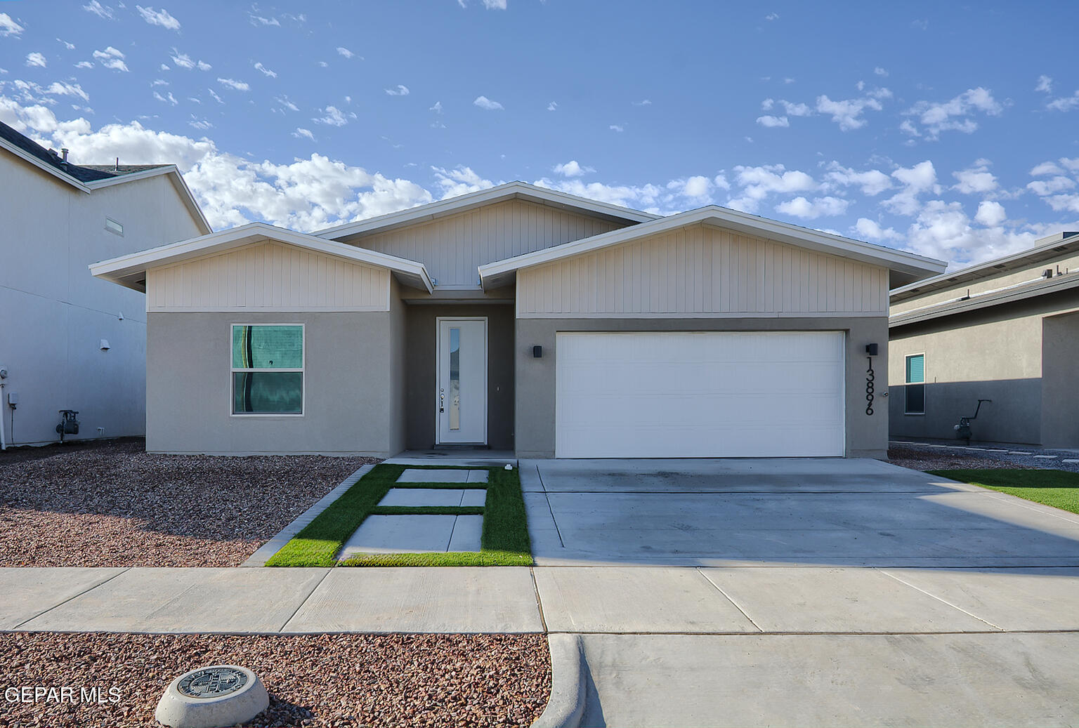 a front view of a house with yard