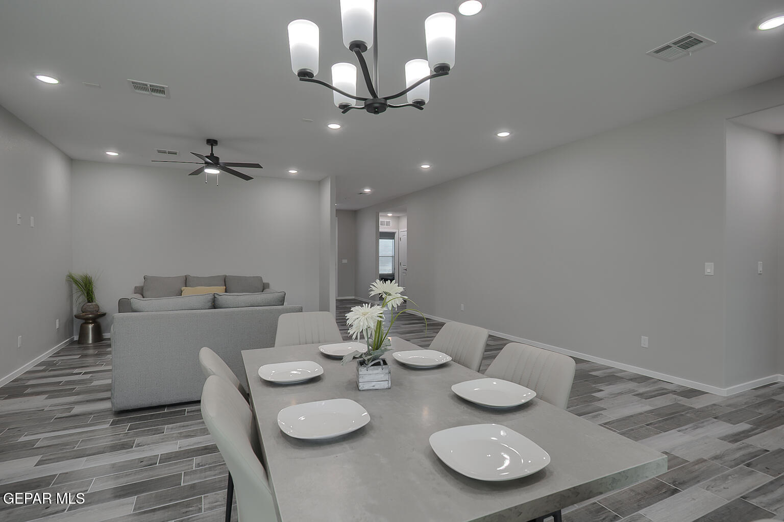 13896 Sky Ranger Avenue El Paso, TX 79928 - Photo 10 of 30 a view of a dining room with furniture and a chandelier