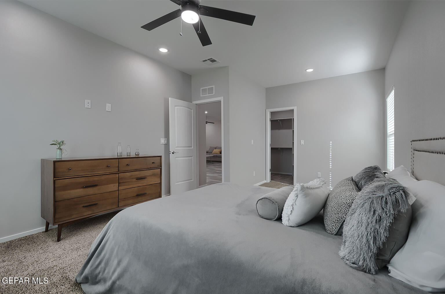 13896 Sky Ranger Avenue El Paso, TX 79928 - Photo 18 of 30 a bedroom with a bed and a ceiling fan