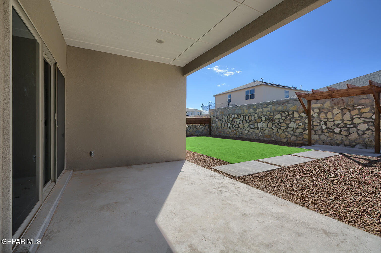 13896 Sky Ranger Avenue El Paso, TX 79928 - Photo 25 of 30 a view of a house with a yard and large tree