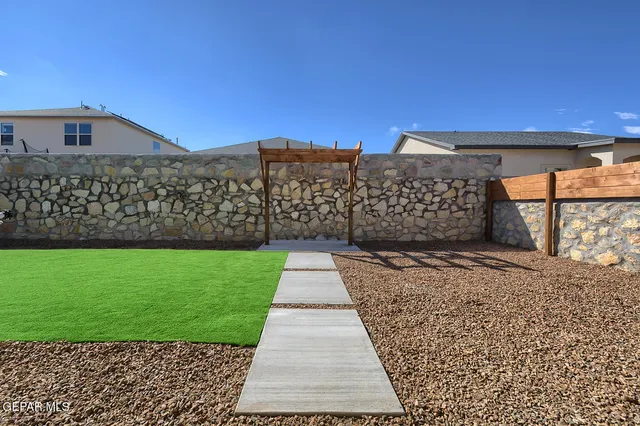 a view of a back yard of the house